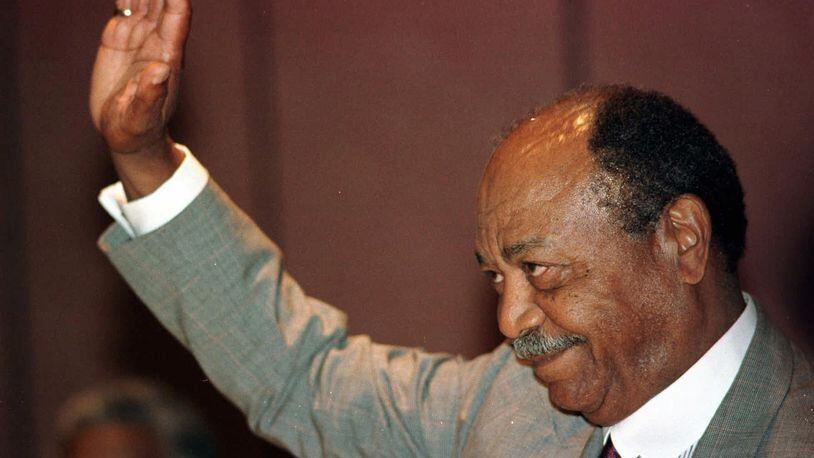 Former Indians star Larry Doby waves to a standing ovation at an All-Star luncheon in his honor in Cleveland on Wednesday, July 2, 1997. Doby broke the color barrier in the American League when he pinch-hit for the Cleveland Indians against Chicago at Comiskey Park. (AP Photo/Piet van Lier)