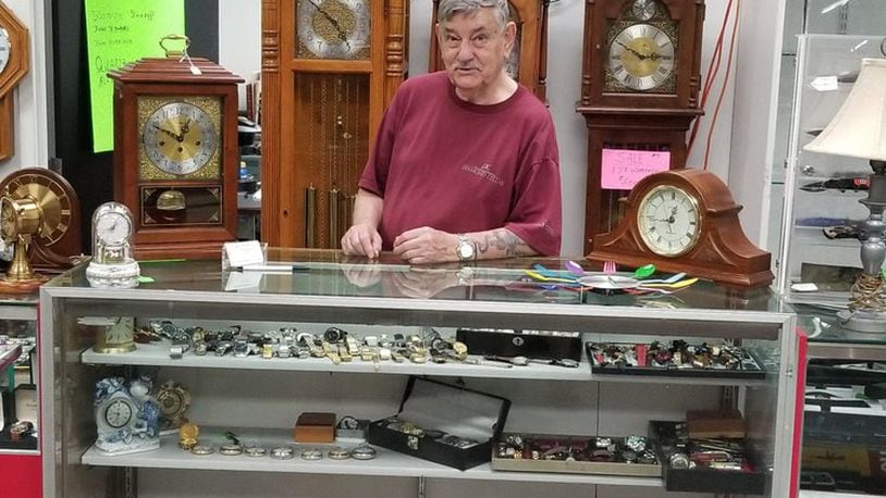 Chuck McKinney takes his refurbished clocks to Springboro Flea Market in Franklin, Ohio, after selling his long-time repair business due to necessity.