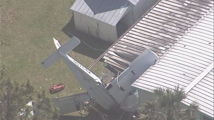 Aerial view of a small plane that crashed into a home in New Smyrna Beach, Fla.