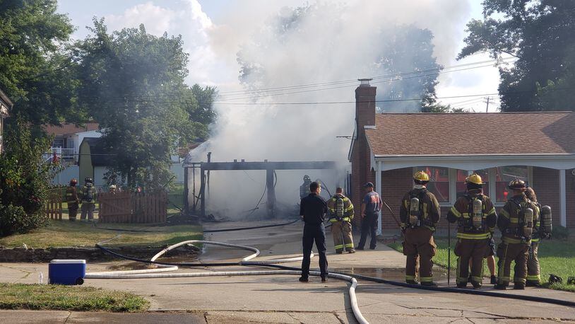 Middletown firefighters were dispatched at 8:40 a.m. to a garage fire engulfed in flames. NICK GRAHAM/STAFF