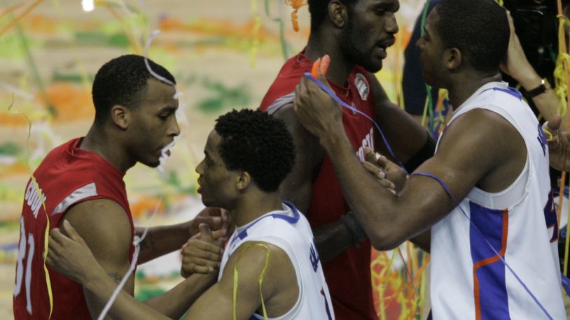 Ohio State guard Daequan Cook, left and teammate Greg Oden congratulate Florida's Taurean Green, second left and Al Horford following Florida's 84-75 victory in the Final Four basketball championship game at the Georgia Dome in Atlanta, Monday, April 2, 2007. (AP Photo/Morry Gash)