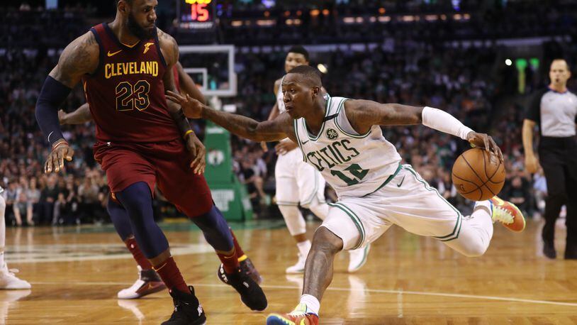 BOSTON, MA - MAY 13: Terry Rozier #12 of the Boston Celtics is defended by LeBron James #23 of the Cleveland Cavaliers during the fourth quarter in Game One of the Eastern Conference Finals of the 2018 NBA Playoffs at TD Garden on May 13, 2018 in Boston, Massachusetts. The Boston Celtics defeated the Cleveland Cavaliers 108-83. (Photo by Maddie Meyer/Getty Images)