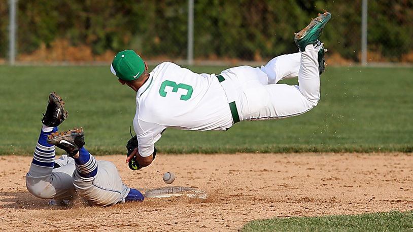 Badin shortstop Daunte DeCello can’t get a handle on the ball while trying to tag Defiance’s Jordan Hutcheson at second base during Wednesday’s game at Alumni Field in Hamilton. CONTRIBUTED PHOTO BY E.L. HUBBARD