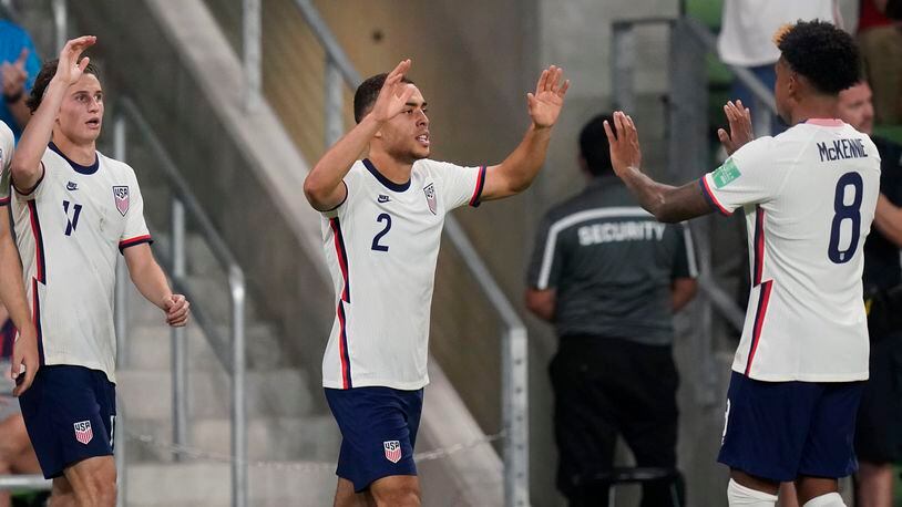 United States' Sergiño Dest (2) celebrates with Weston McKennie (8) after the team scored against Jamaica during a FIFA World Cup qualifying soccer match, Thursday, Oct. 7, 2021, in Austin, Texas. (AP Photo/Eric Gay)
