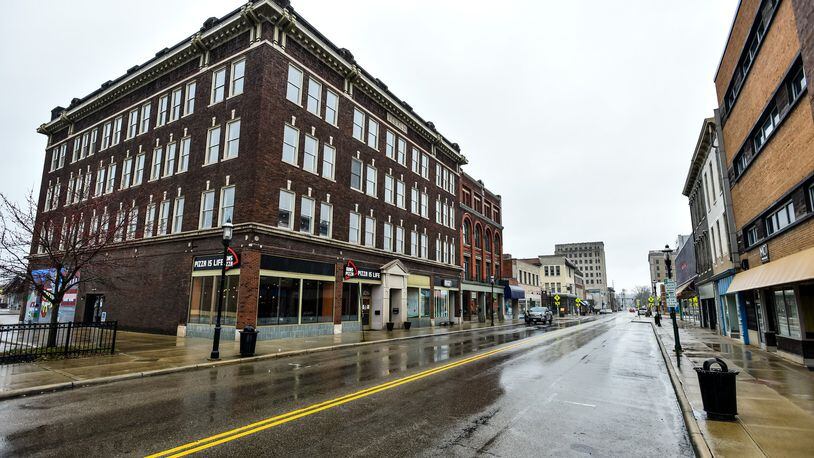 Central Avenue in downtown Middletown has fewer cars parked along the street than normal Wednesday. The state has banned all dine-in food consumption to help reduce the spread of coronavirus and many people are working from home. NICK GRAHAM/STAFF
