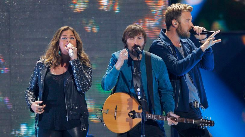 Hillary Scott, from left, Dave Haywood and Charles Kelley, of Lady Antebellum, perform at the CMT Music Awards at Bridgestone Arena on Wednesday, June 10, 2015, in Nashville, Tenn. (Photo by Wade Payne/Invision/AP)