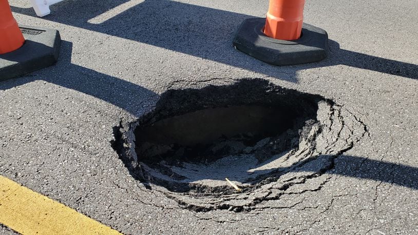A large sink hole opened up Sunday night on West Chester Road and officials say the road will be closed for a week or more while they fix the problem. CONTRIBUTED