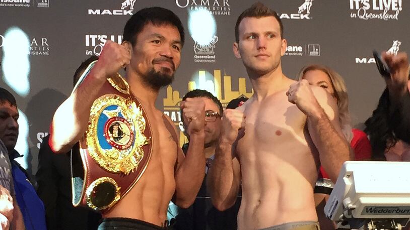 Manny Pacquiao, left, and Jeff Horn pose for a photo after weighing in, Tuesday, July 1, 2017, in Brisbane, Australia. Pacquiao, is putting his WBO welterweight world title on the line Sunday, July 2, against the 29-year-old Horn. (AP Photo/John Pye)