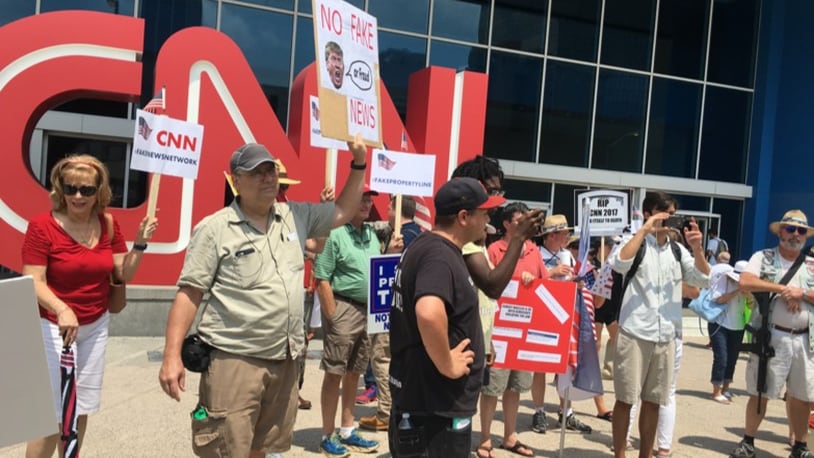 About 30 people protested Saturday CNN coverage of President Donald Trump in front of the news outlet's main headquarters in Atlanta. (Photo: Rhonda Cook/The Atlanta Journal-Constitution)
