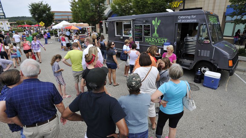 CUTLINE FOR 112115 WC MERCHANTS: Union Centre Boulevard Merchant Association already donates a percentage of profits from its annual Union Centre Food Truck Rally to an area non-profit. It recently gave $11,000 to Reach Out Lakota, a food and clothing pantry serving West Chester and Liberty townships. STAFF FILE PHOTO / 2014