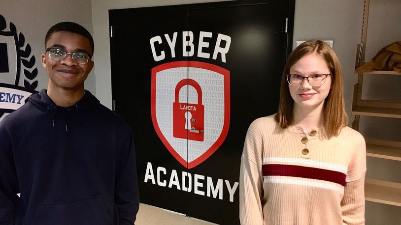 Lakota East High School students Joshua Alonge and Addy Price are two members of Lakota Schools’ new Cyber Academy designed to teach the computer skills necessary to prepare teens for internships in the booming cyber security industry. The academy holds classes at both Lakota East and Lakota West High School in the Butler County district. (Photo By Michael D. Clark/Journal-News)