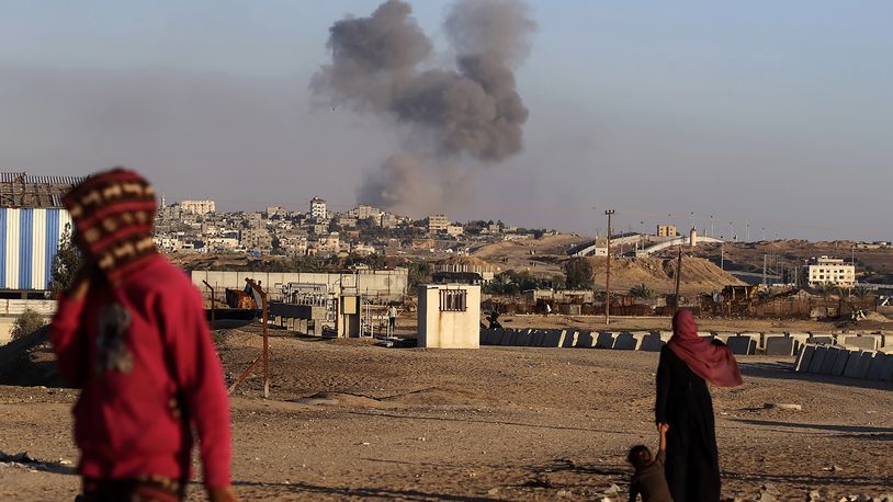 Smoke rises following an Israeli airstrike on buildings near the separating wall between Egypt and Rafah, southern Gaza Strip, Tuesday, May 7, 2024. (AP Photo/Ramez Habboub)