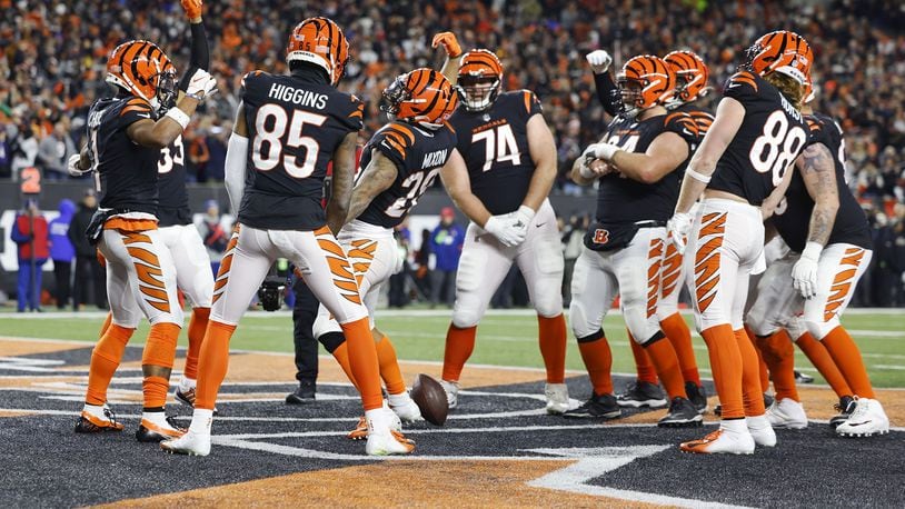 The Cincinnati Bengals celebrate a first-half touchdown against the Baltimore Ravens in a wild-card playoff game at Paycor Stadium on Jan. 15, 2023. Nick Graham/STAFF