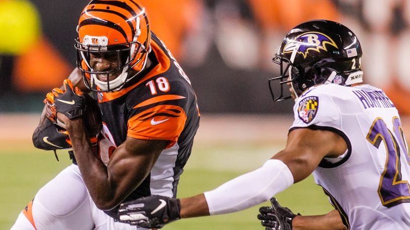 Cincinnati Bengals wide receiver A.J. Green carries the ball in for a touchdown during their game against the Baltimore Ravens Thursday, Sept. 13 at Paul Brown Stadium in Cincinnati. The Cincinnati Bengals defeated the Baltimore Ravens 34-23. NICK GRAHAM/STAFF