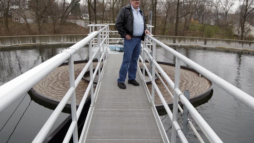 Terry Morris, Veolia Water’s project manager for the Springboro waste water treatment plant, looks out over the clarifier tanks that are part of the upgraded facility in 2011. Morris continues to work at Springboro utility plants.