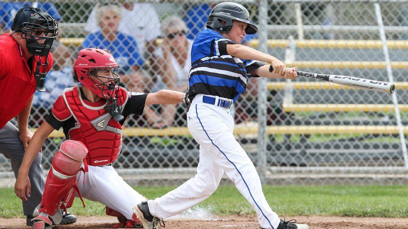 Hamilton West Side’s Nick Brosius takes a cut against Canfield during the state tournament in Maumee. Brosius and Clint Moak are the two 11-year-olds who are part of Hamilton’s 12-year-old all-star squad. CONTRIBUTED PHOTO BY SCOTT GRAU