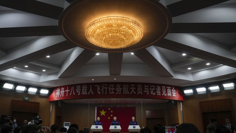 Chinese astronauts for the upcoming Shenzhou-18 mission Ye Guangfu, center, Li Guangsu, left, and Li Cong attend a meeting with the press at the Jiuquan Satellite Launch Center in northwest China, Wednesday, April 24, 2024. (AP Photo/Andy Wong)