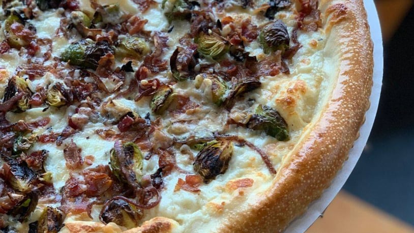 Dewey’s Van Damme pizza features Brussels sprouts tossed in truffle oil, bacon, beer braised onions and parmesan cheese. The pizza is available through Dec. 12. CONTRIBUTED PHOTO