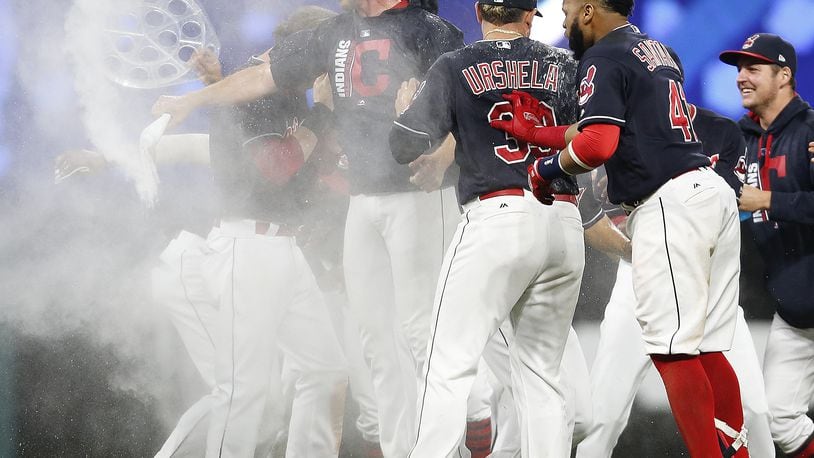 CLEVELAND, OH - SEPTEMBER 14: Cleveland Indians celebrate victory in the 10th inning over the Kansas City Royals at Progressive Field on September 14, 2017 in Cleveland, Ohio. The Indians defeated the Royals 3-2 for their 22nd win in a row, an MLB record. (Photo by Ron Schwane/Getty Images)