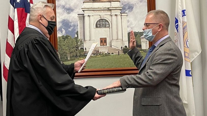 Butler County Common Pleas Court Judge Noah Powers swears in the newest member of the Veterans Service Commission Jim Eriksen on Jan. 20, 2021.