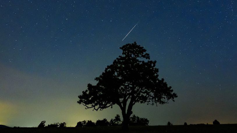 A meteorite of the swarm of meteorites Perseida illuminate at the sky above Salgotarjan, Hungary, early Tuesday, Aug. 13, 2019.