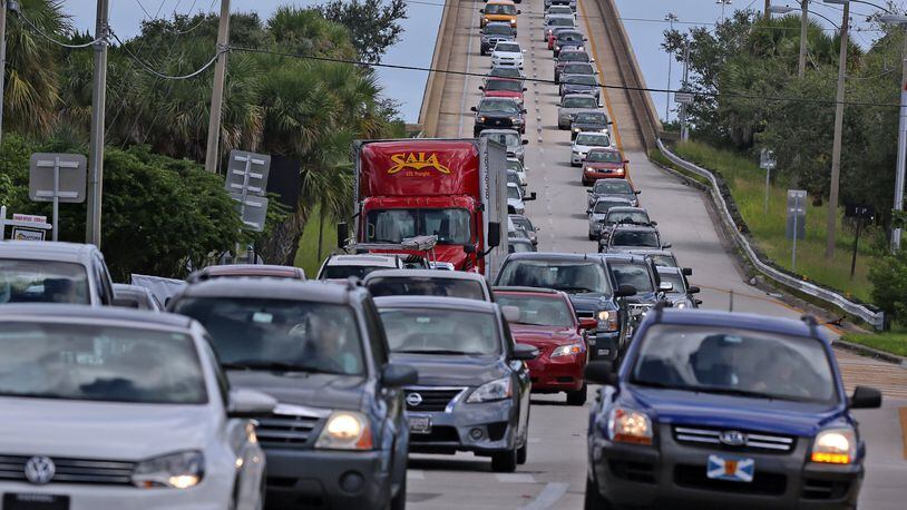 People in vehicles make an evacuation route on Wednesday, Oct. 5, 2016 over a Florida State Road 520 bridge heading west from Merritt Island, Fla. Preparations have begun to evacuate Florida’s coastal communities as Hurricane Matthew becomes a threat. (Red Huber/Orlando Sentinel/TNS)