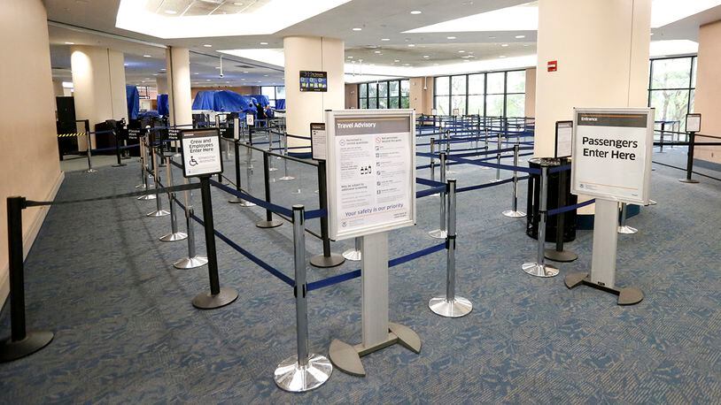 There are no lines to board flights at the Palm Beach International airport after flights in and out were cancelled in the afternoon as Hurricane Matthew advances, Thursday, Oct. 6, 2016, in West Palm Beach, Fla. Officials at Florida's major airports are monitoring conditions as Hurricane Matthew bears down on Florida. (AP Photo/Wilfredo Lee)