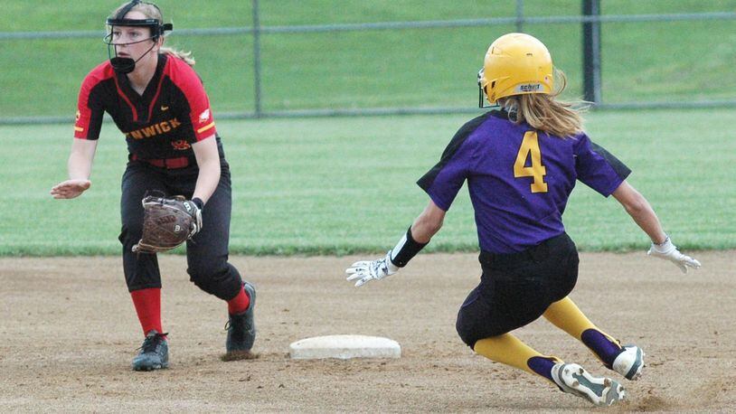 Bellbrook’s Kendall Knisely (4) is safe at second base ahead of the throw to Fenwick shortstop Abby Gustely on Thursday during a Division II sectional softball game in Middletown. Bellbrook won 9-5. RICK CASSANO/STAFF