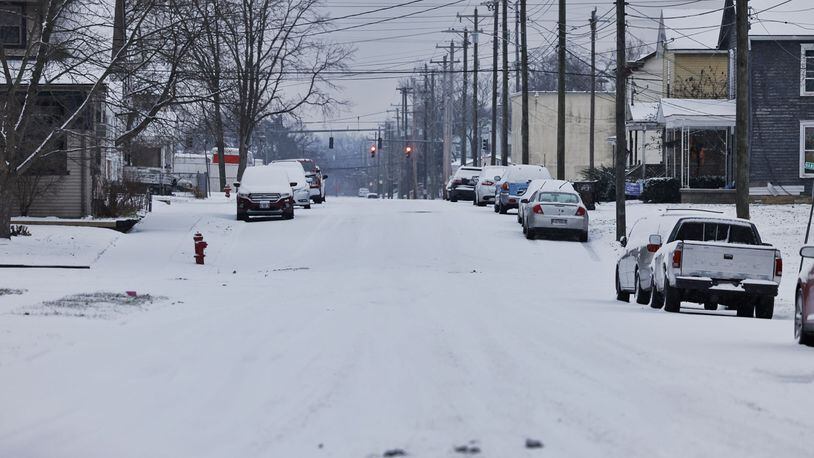 Snow covered the streets of Hamilton, Ohio Jan. 17, 2022. NICK GRAHAM/STAFF