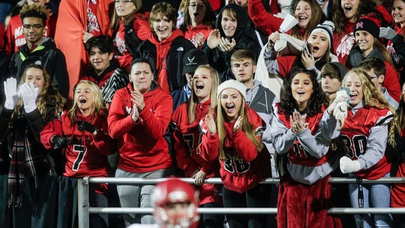 Madison fans cheer for their team during a 42-7 win over West Jefferson in the Division V, Region 20 final Nov. 17, 2017, at Beavercreek. NICK GRAHAM/STAFF