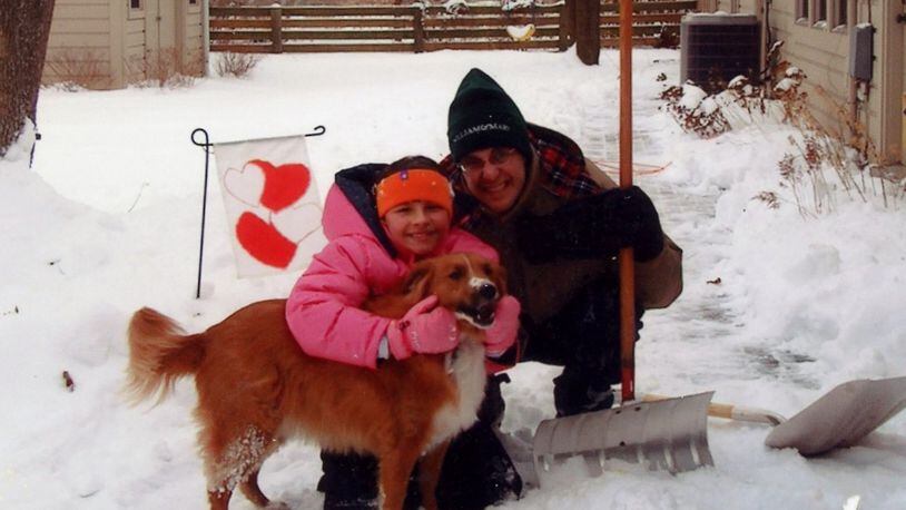 A younger Jordan and Ed playing in the snow with passed dog, Lucy. KARIN SPICER