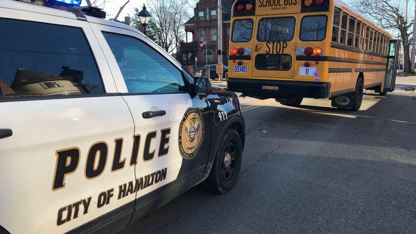 Hamilton emergency crews respond to the scene of a minor crash involving a school bus this morning, Friday, Feb. 2, 2018. NICK GRAHAM / STAFF