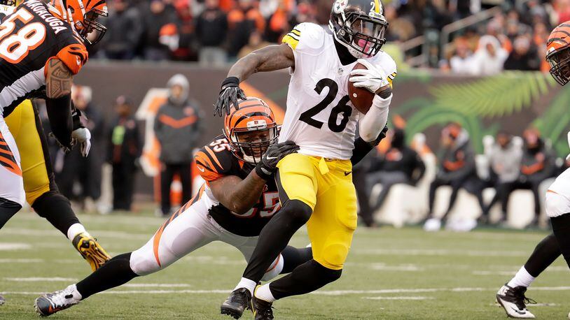 Bengals linebacker Vontaze Burfict,  seen here tackling Steelers refugee/holdout running back Le'Veon Bell last season at Paul Brown Stadium on December 18, doesn't like Pittsburgh. Those folks don't like him much, either, apparently.