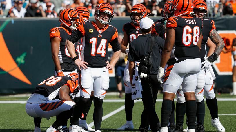Cincinnati Bengals quarterback Andy Dalton (14) reacts in the first half of an NFL football game against the Jacksonville Jaguars, Sunday, Oct. 20, 2019, in Cincinnati. (AP Photo/Frank Victores)