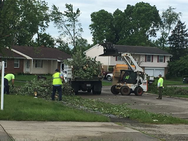 PHOTOS: Tornado-damaged communities dig out, clean up