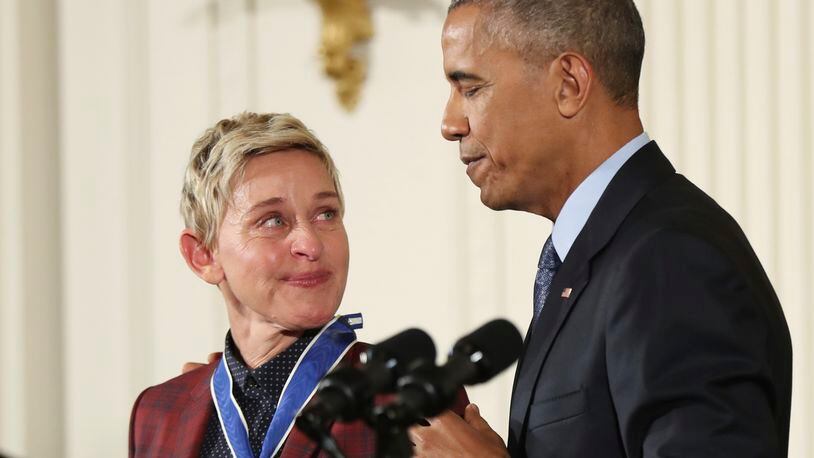 Actress, comedian, and talk show host Ellen DeGeneres, glances at President Barack Obama as she is presented the Presidential Medal of Freedom during a ceremony in the East Room of the White House Tuesday, Nov. 22, 2016, in Washington. Obama is recognizing 21 Americans with the nation's highest civilian award, including giants of the entertainment industry, sports legends, activists and innovators. (AP Photo/Manuel Balce Ceneta)
