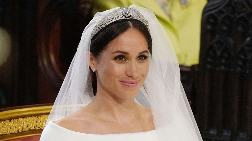 Meghan Markle's Givenchy wedding dress pays homage to her new British life and American heritage with elegant detail.