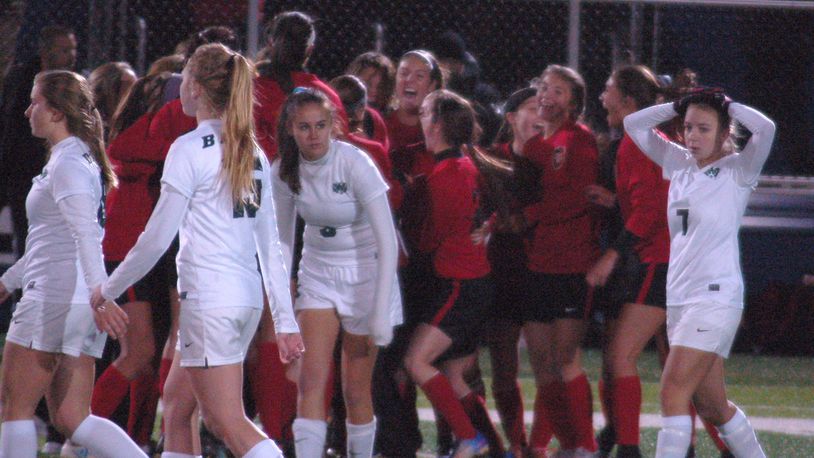 Badin’s players (in white) react as Tippecanoe celebrates a 1-0 victory in a Division II regional semifinal at Chaminade Julienne’s Roger Glass Stadium on Tuesday night. CONTRIBUTED PHOTO BY JOHN CUMMINGS