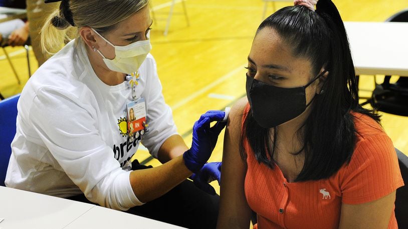 Brittany Arquelles, age 12, prepares for her COVID-19 vaccine Friday June 4, 2021. Dayton Children’s partners with Boys & Girls Club of Dayton to offer COVID-19 vaccine clinic for individuals 12 years and older. MARSHALL GORBY\STAFF