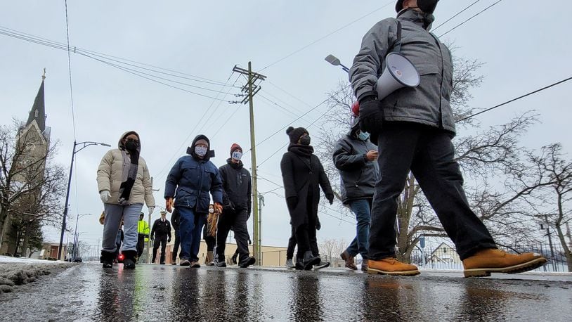 Rev. Victor Davis led a Martin Luther King Jr. Day march Monday, Jan. 17, 2022 in Hamilton. A group of nearly 20 people marched from Payne Chapel A.M.E. Church On Front Street to High Street to Martin Luther King Jr. Blvd. then back to Payne Church. NICK GRAHAM/FILE