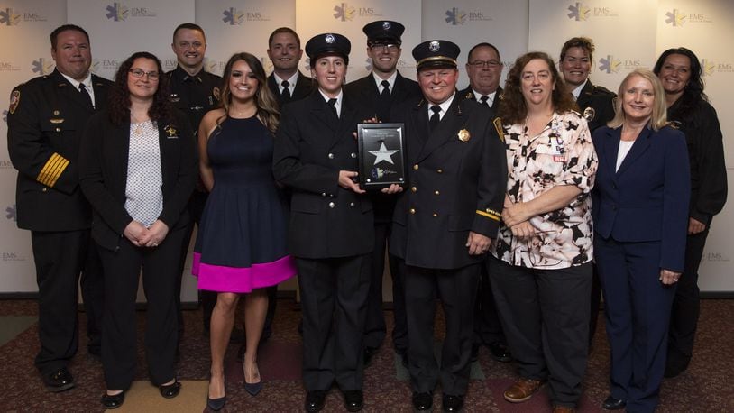 Oxford EMS personnel were in Columbus May 22 to recognize efforts saving the life of Karen Sauerland, after she collapsed at work at Schneider Electric April 4, 2018. Also on hand were police and McCullough-Hyde Memorial Hospital representatives, emphasizing the teamwork effort to save her life. CONTRIBUTED