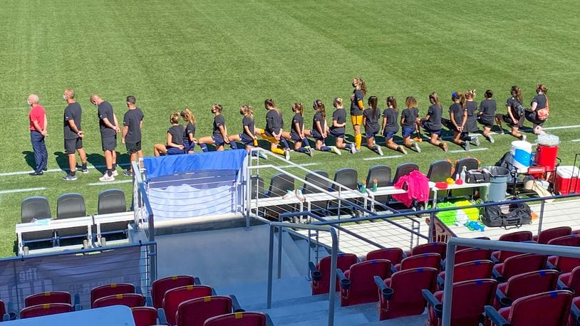Samantha Leshnak-Murphy, a goalie for the North Carolina Courage, a member of the National Women’s Soccer League, stood for the National Anthem Saturday night while her teammates knelled. CONTRIBUTED BY ALEX VEJAR / THE SALT LAKE TRIBUNE.