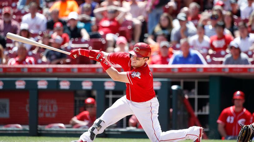CINCINNATI, OH - JULY 23: Scooter Gennett #4 of the Cincinnati Reds singles to right field to drive in a run in the fifth inning of a game against the Miami Marlins at Great American Ball Park on July 23, 2017 in Cincinnati, Ohio. The Reds defeated the Marlins 6-3. (Photo by Joe Robbins/Getty Images)