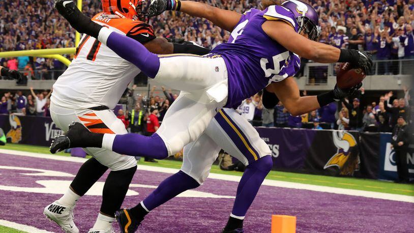 MINNEAPOLIS, MN - DECEMBER 17: Eric Kendricks #54 of the Minnesota Vikings dives with the ball for a touchdown after intercepting Andy Dalton #14 of the Cincinnati Bengals in the first quarter of the game on December 17, 2017 at U.S. Bank Stadium in Minneapolis, Minnesota. (Photo by Adam Bettcher/Getty Images)