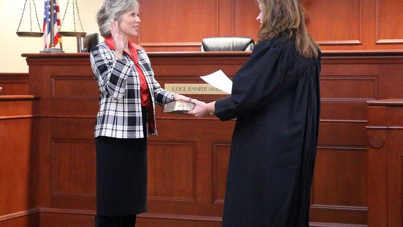 Butler County Common Pleas Court Judge Jennifer Muench-McElfresh swears in new County Auditor Nancy Nix on Feb. 13, 2023