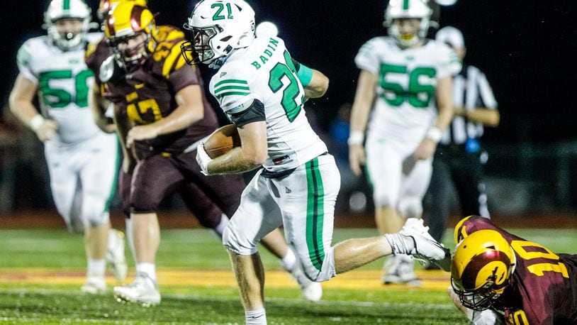 Badin's John Rawlings carries the ball against Ross on Friday, August 28, 2020. The Rams blasted CJ 40-14 on Saturday night at Edgewood. NICK GRAHAM / STAFF
