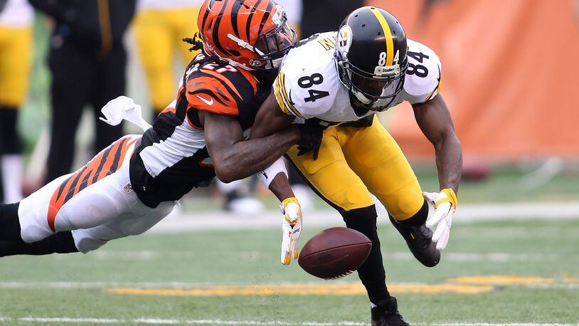 Bengals cornerback Dre Kirkpatrick breaks up a pass intended for Antonio Brown of the Steelers in a 2015 game in Paul Brown Stadium. They sure looked friendly over the weekend.