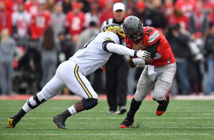 Ohio State holds off Michigan 30-27 in 2 OT