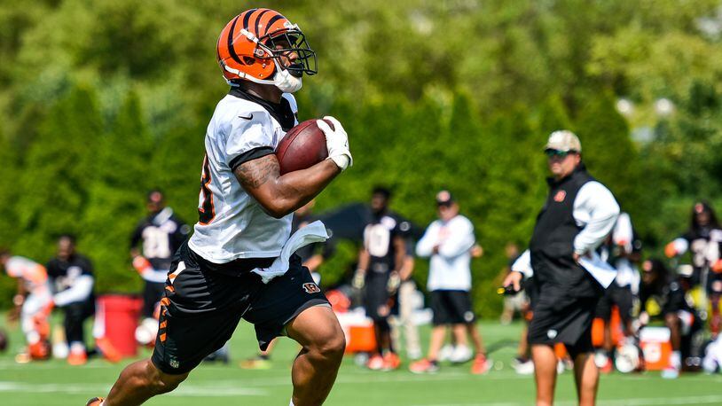 Running back Joe Mixon carries the ball during the first day of Cincinnati Bengals Training Camp Friday, July 28 at the practice fields beside Paul Brown Stadium in Cincinnati. NICK GRAHAM/STAFF