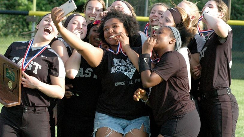 It was selfie time for Lakota East’s softball players Friday after their 3-0 victory over Lebanon in a Division I district championship game at Centerville. RICK CASSANO/STAFF